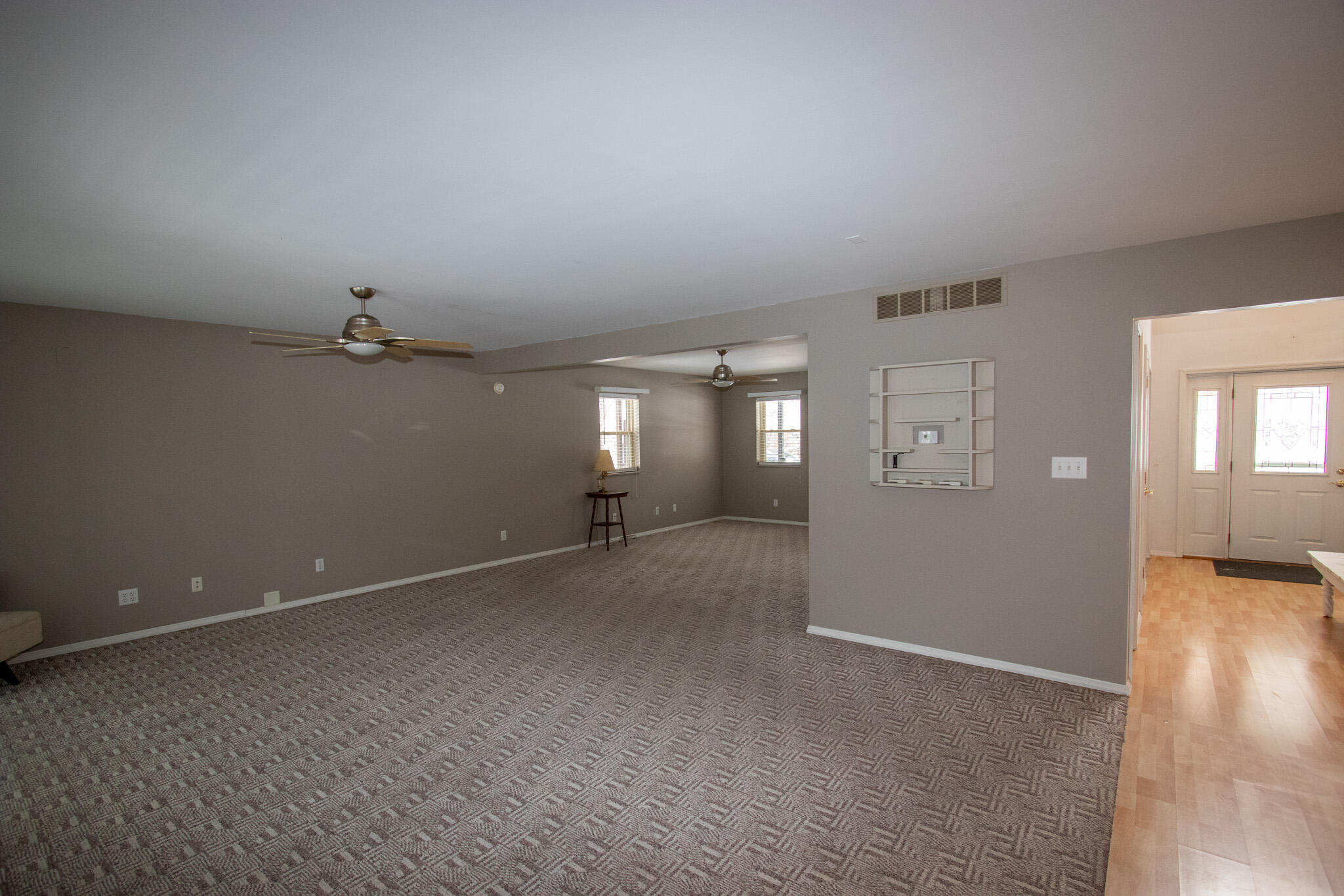 107 Center Street Michigan City, IN 46360 - Photo 21 of 67 an empty room with windows and entrance