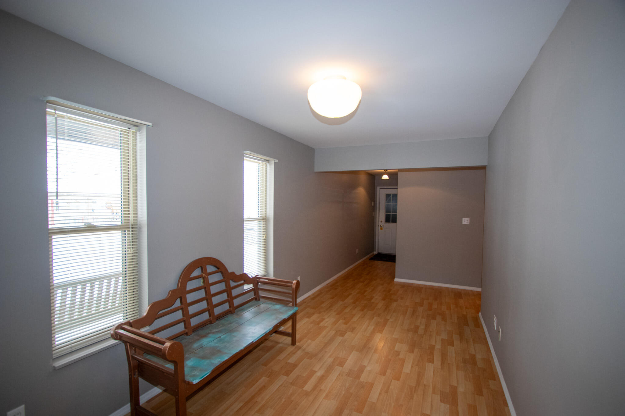 107 Center Street Michigan City, IN 46360 - Photo 27 of 67 a view of a room with wooden floor and windows