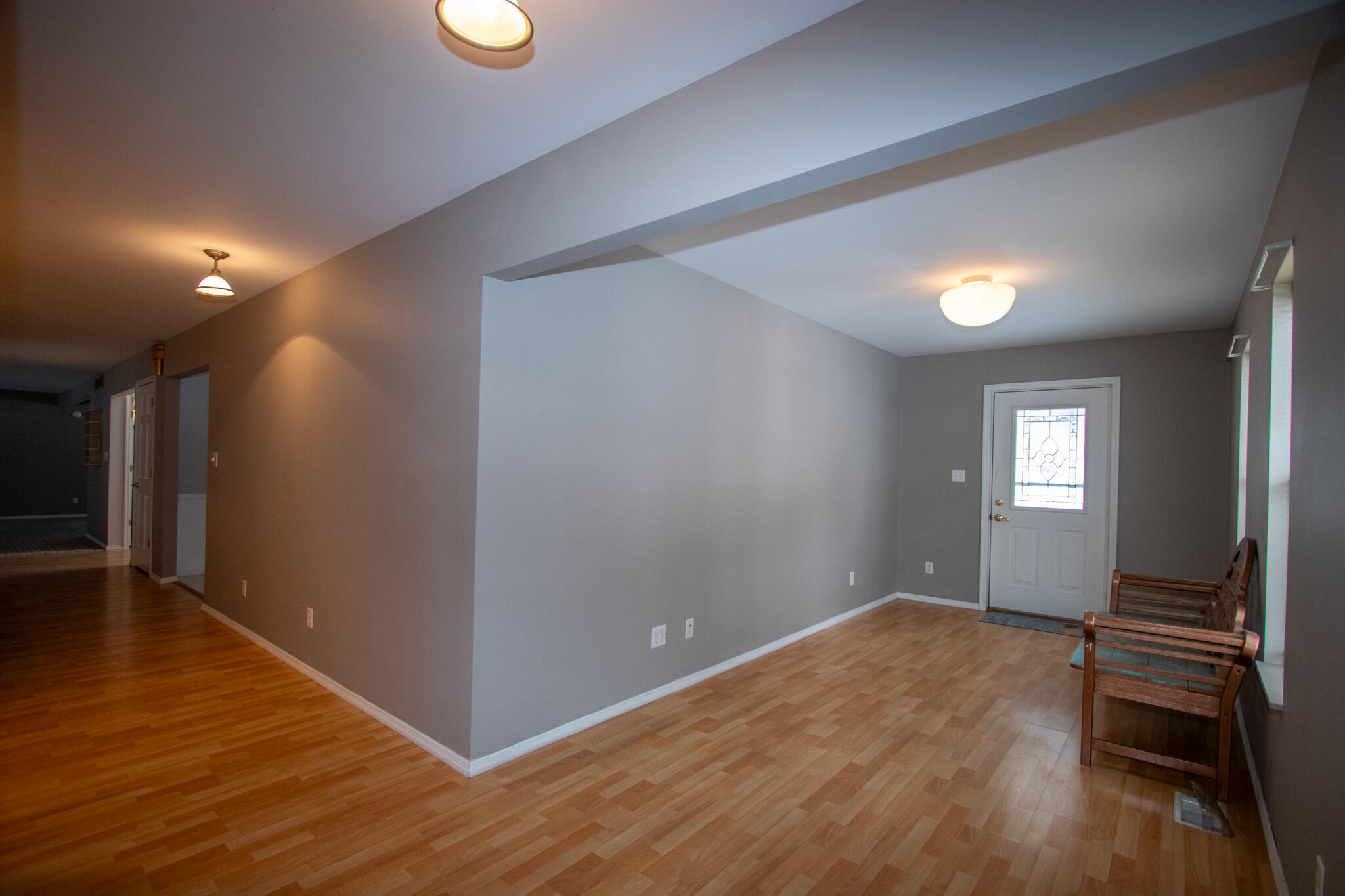 107 Center Street Michigan City, IN 46360 - Photo 29 of 67 wooden floor in an empty room with a window