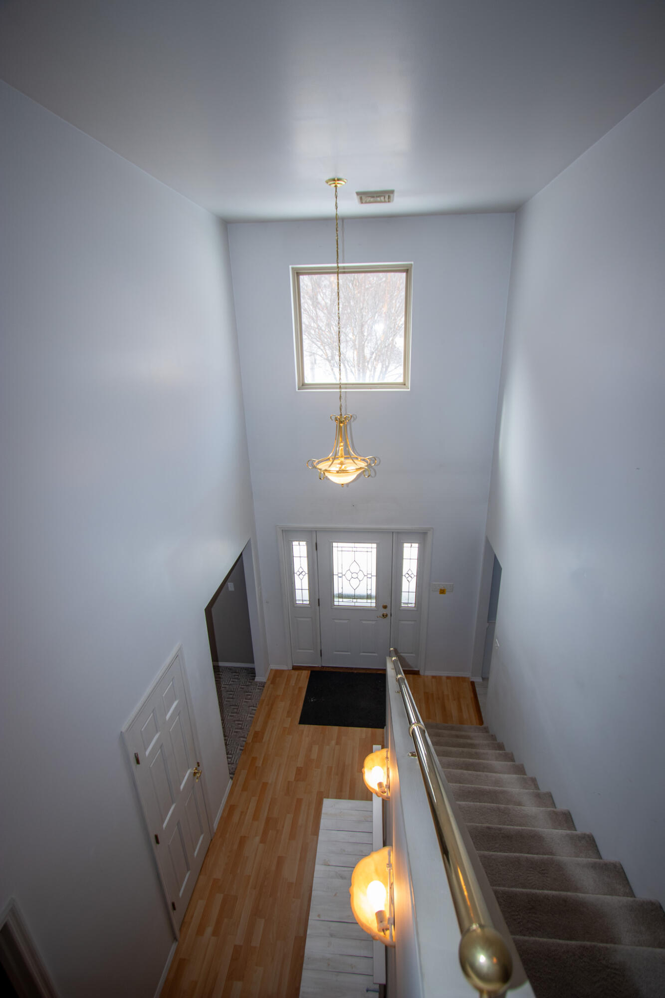 107 Center Street Michigan City, IN 46360 - Photo 31 of 67 wooden floor and windows in an empty room