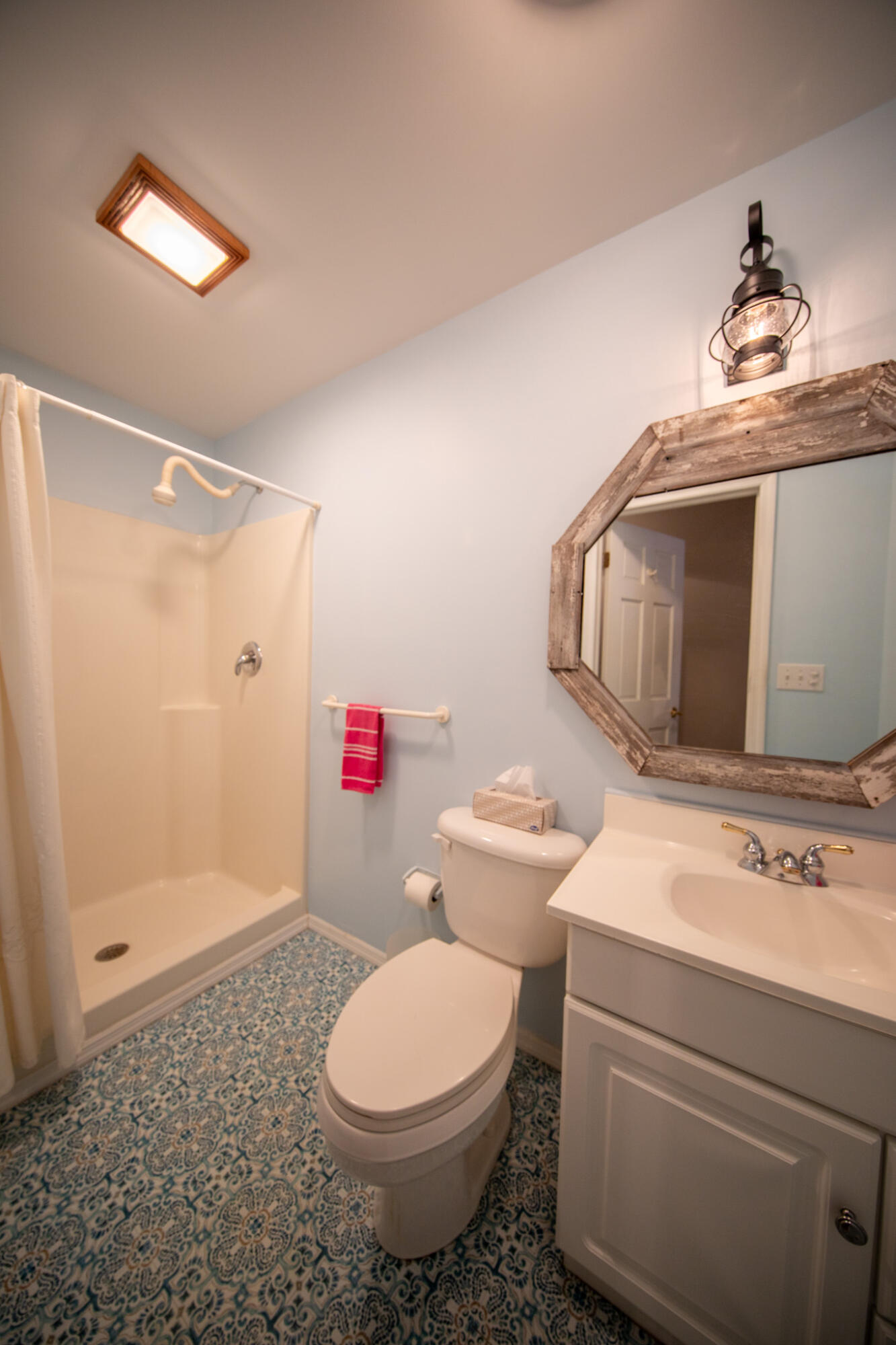 107 Center Street Michigan City, IN 46360 - Photo 33 of 67 a bathroom with a toilet sink and shower