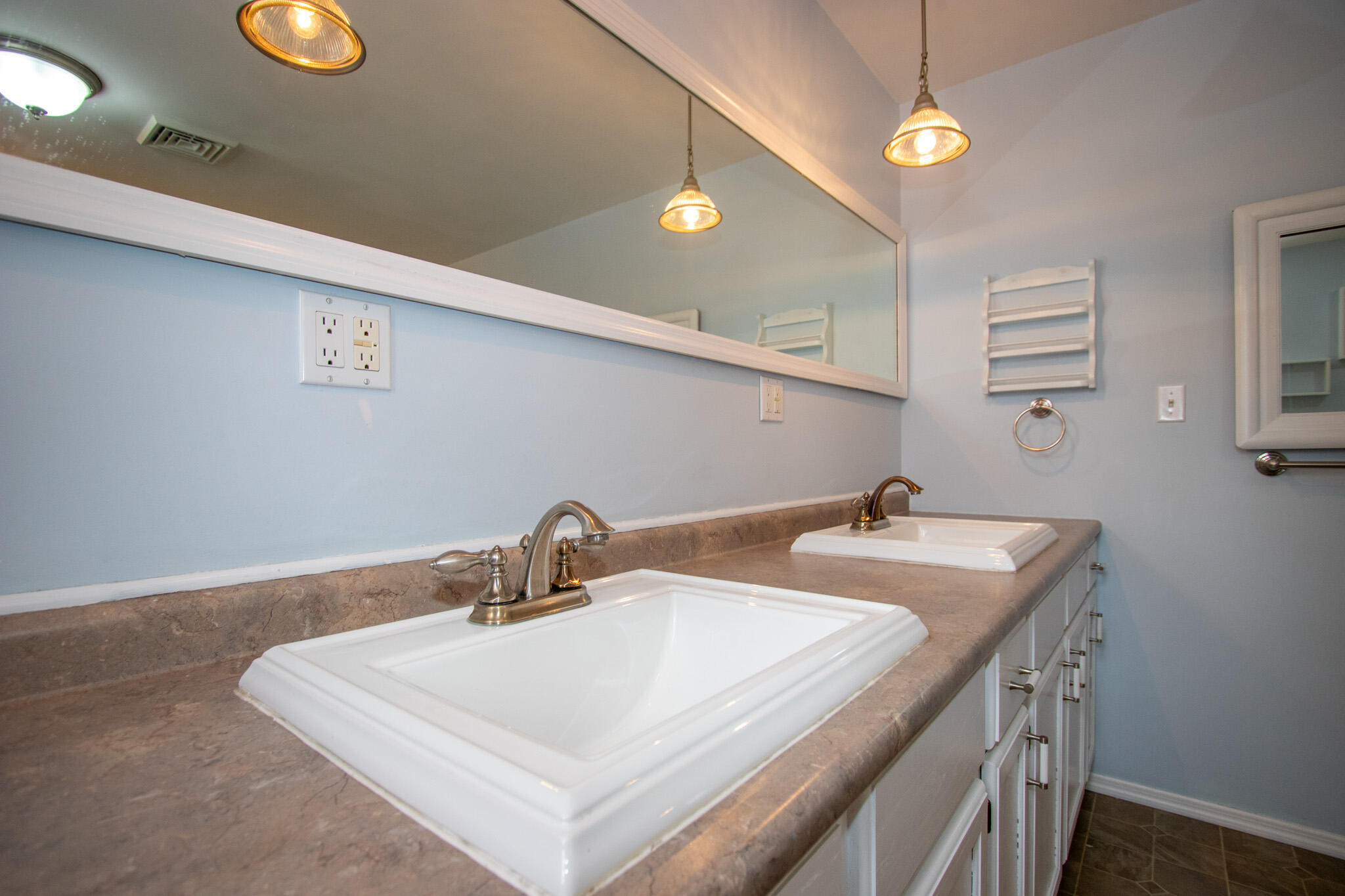 107 Center Street Michigan City, IN 46360 - Photo 38 of 67 a bathroom with a sink vanity and a mirror