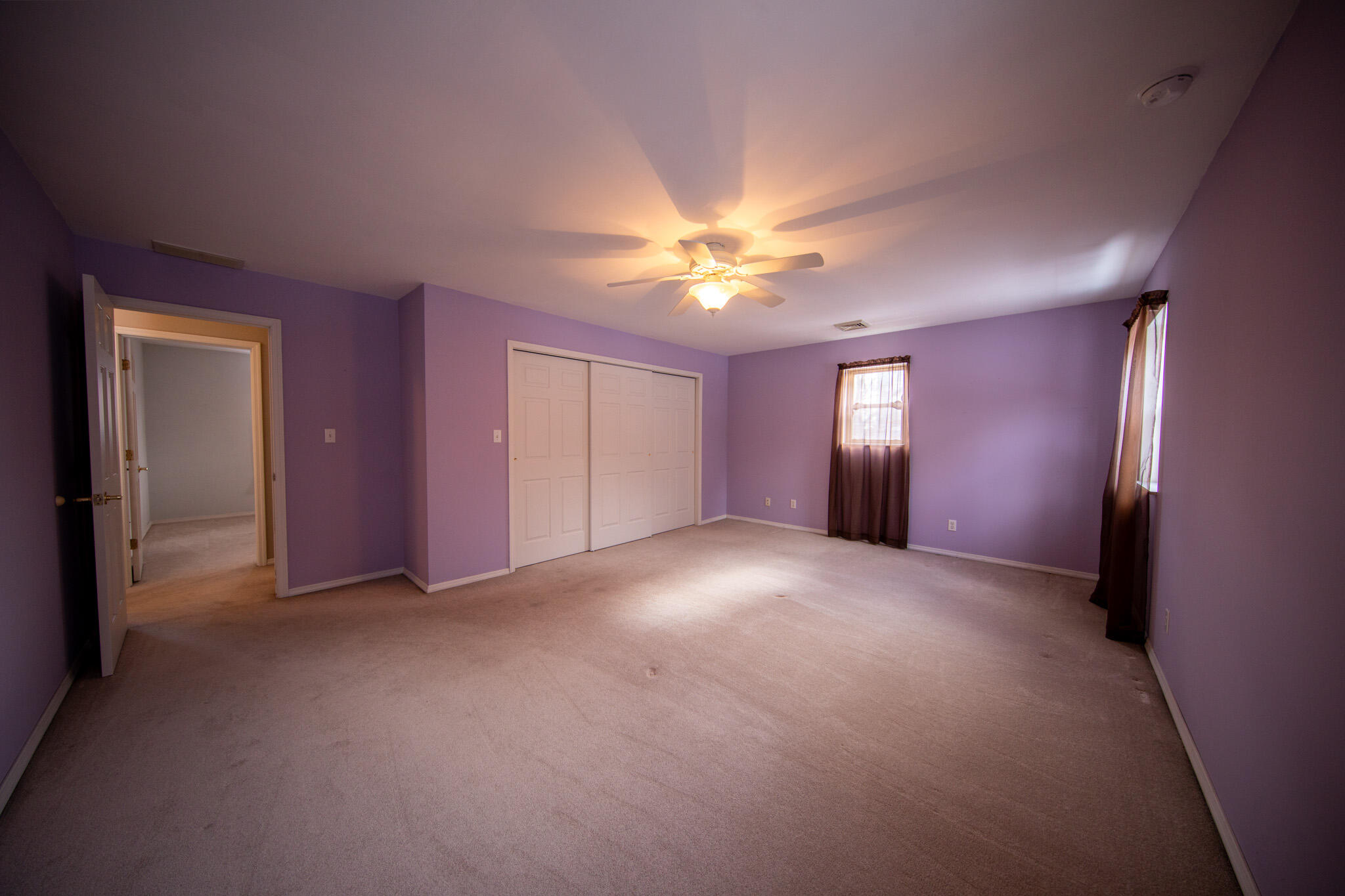107 Center Street Michigan City, IN 46360 - Photo 44 of 67 a view of empty room with a ceiling fan