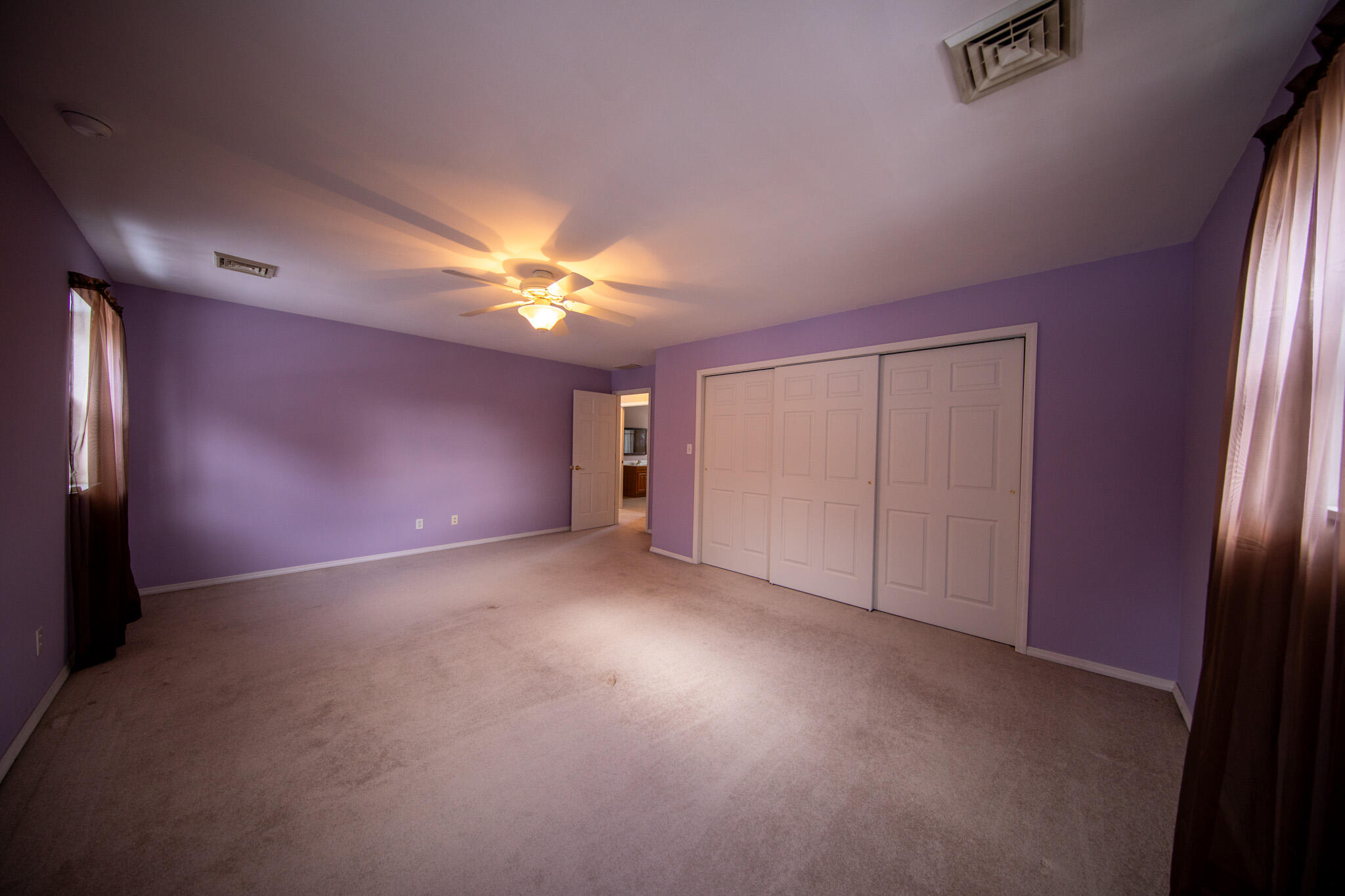 107 Center Street Michigan City, IN 46360 - Photo 45 of 67 a view of an empty room with a chandelier fan
