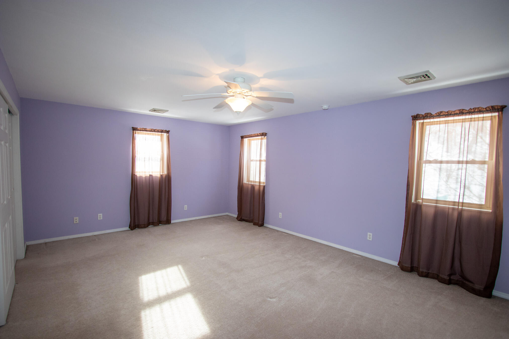 107 Center Street Michigan City, IN 46360 - Photo 46 of 67 an empty room with windows and closet