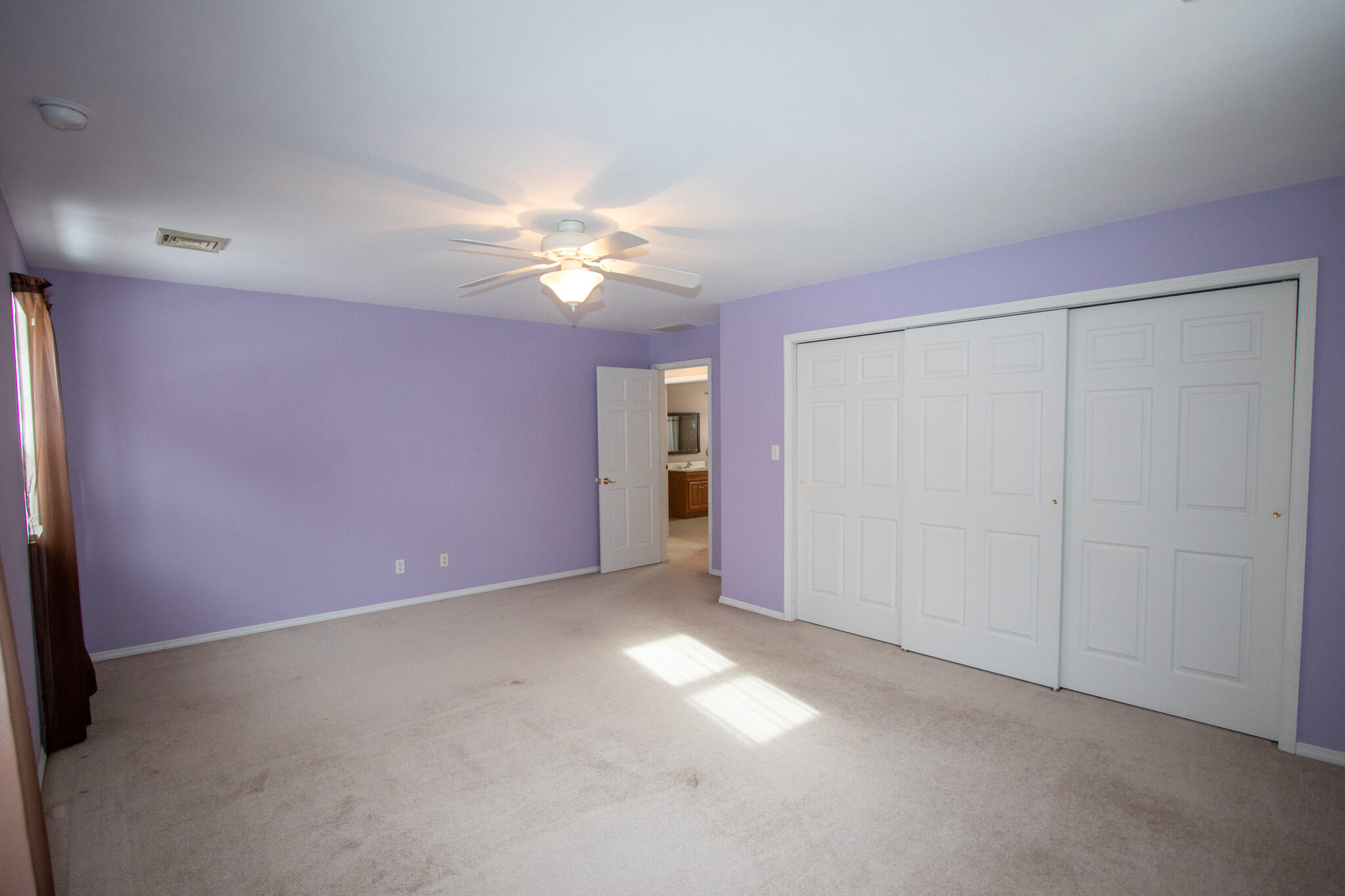 107 Center Street Michigan City, IN 46360 - Photo 47 of 67 an empty room with chandelier fan
