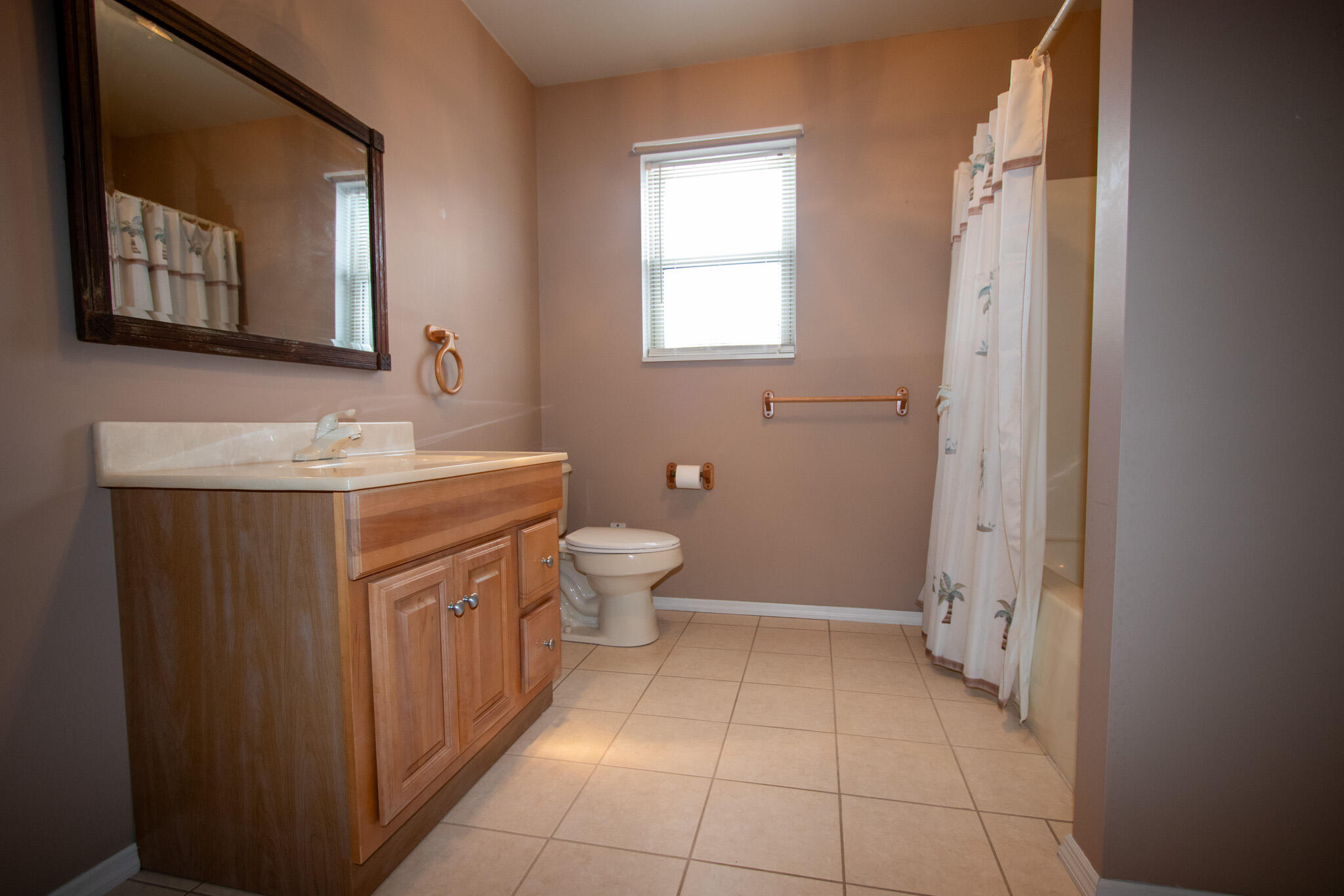 107 Center Street Michigan City, IN 46360 - Photo 51 of 67 a bathroom with a toilet sink and mirror