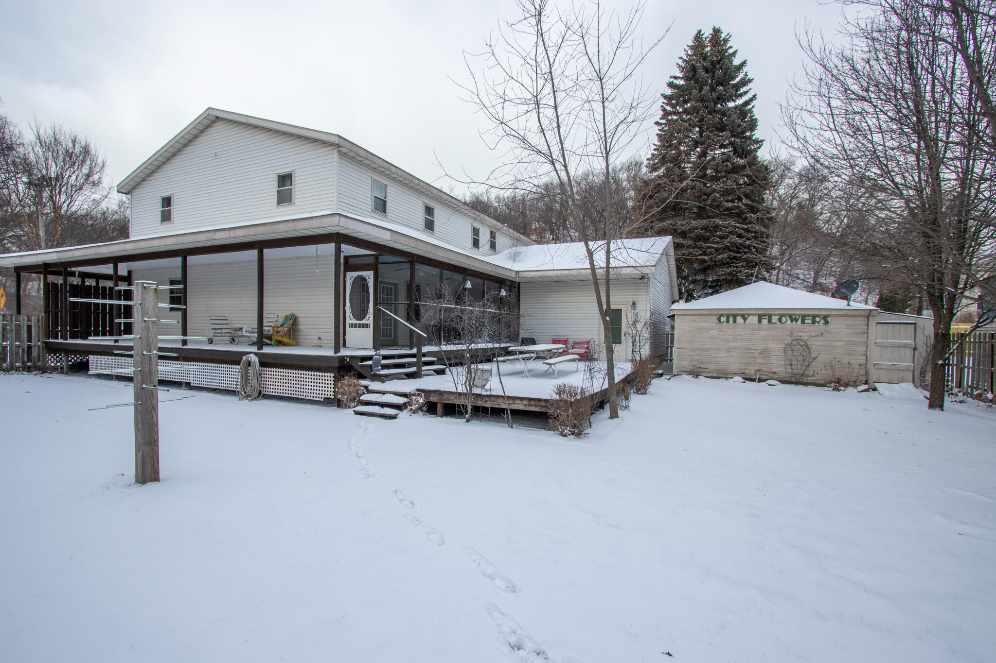 107 Center Street Michigan City, IN 46360 - Photo 61 of 67 a view of a house with roof and wooden fence