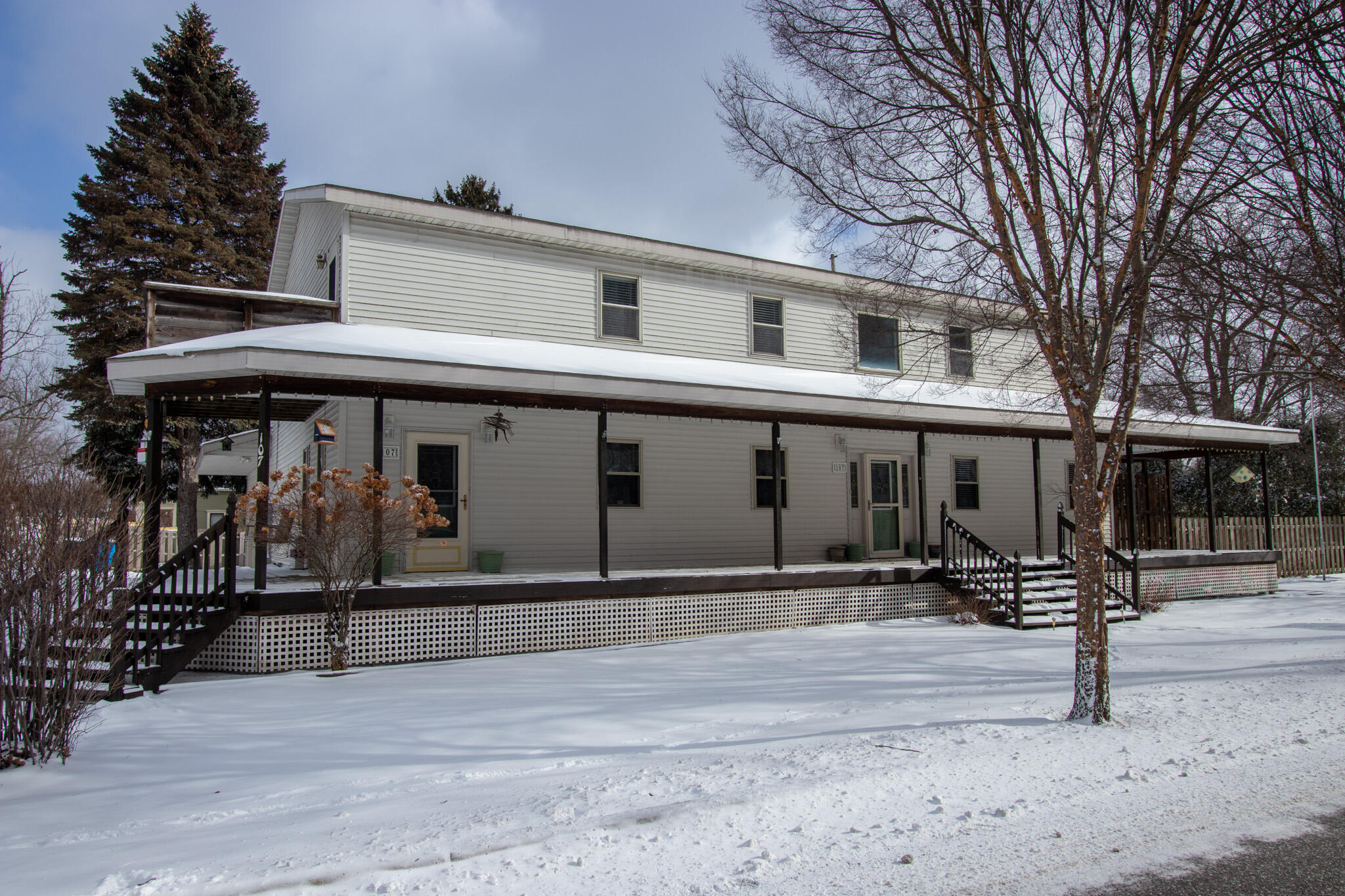 107 Center Street Michigan City, IN 46360 - Photo 9 of 67 a front view of a building with parking area