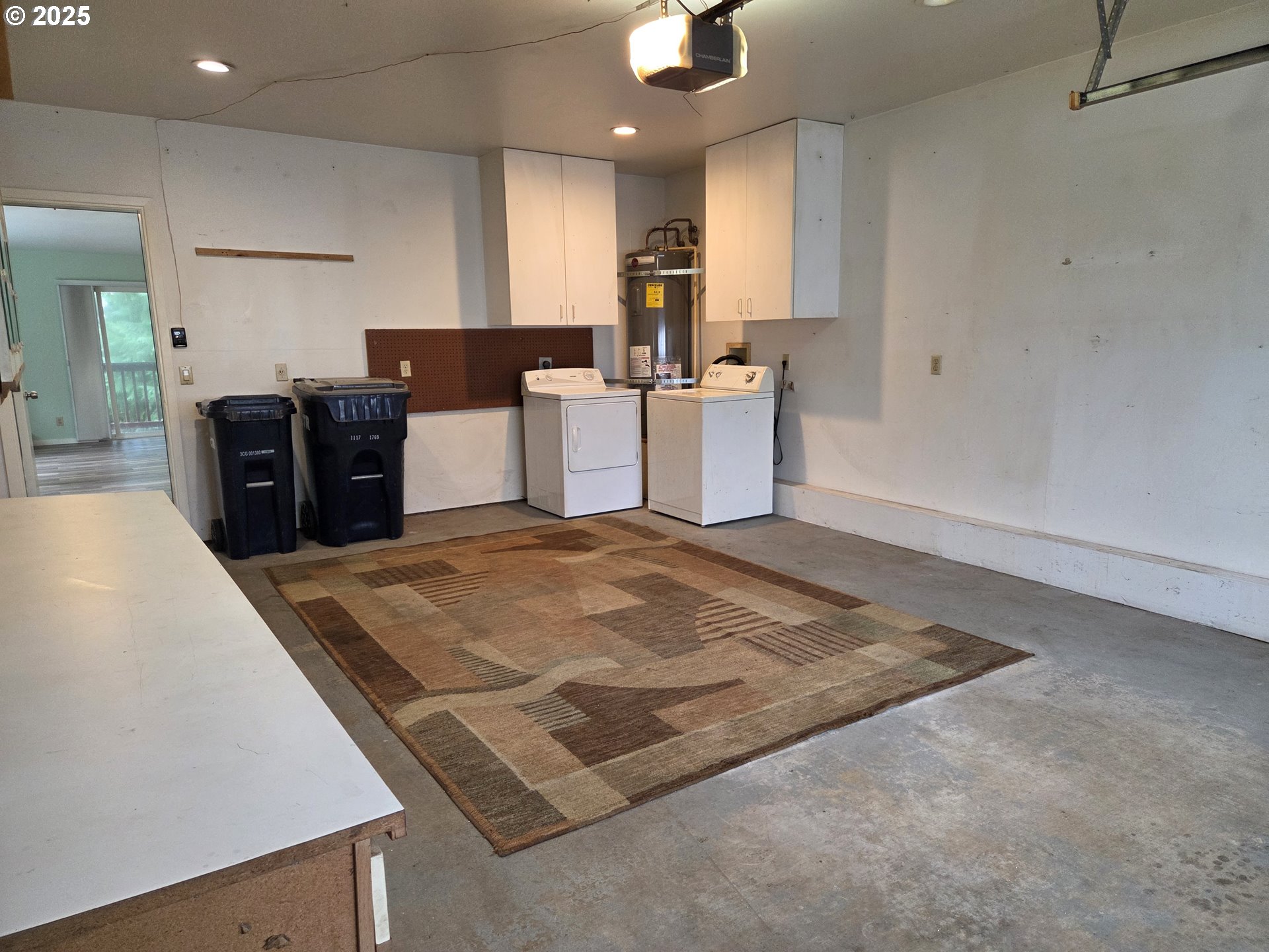 1455 Seacrest Lane, Unit 1A Brookings, OR 97415 - Photo 28 of 32 a kitchen with stainless steel appliances granite countertop a sink dishwasher a refrigerator a microwave oven with white cabinets and granite countertops