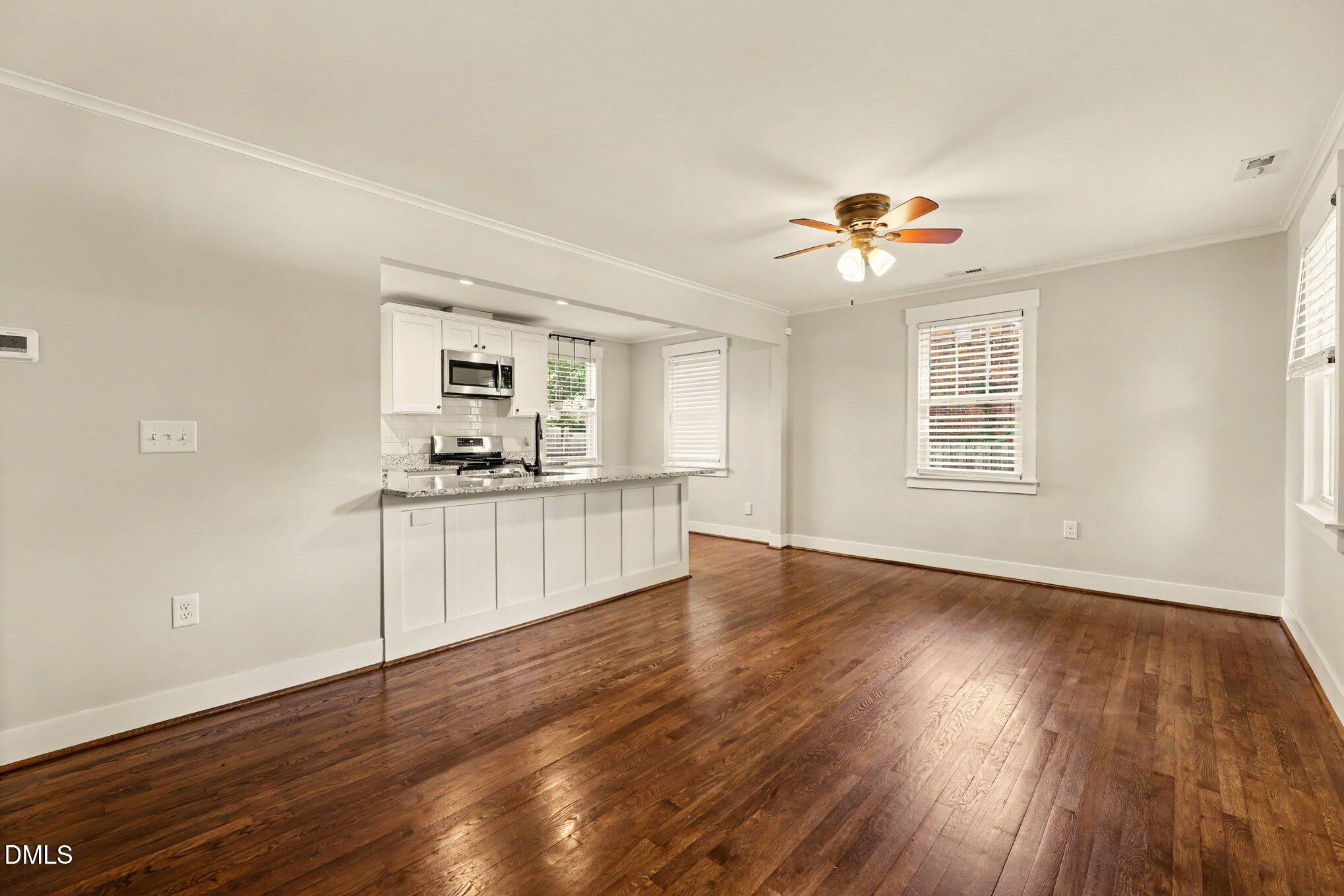2111 Milburnie Road Raleigh, NC 27610 - Photo 5 of 27 Living room view open to kitchen