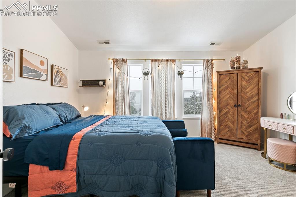 997 Burning Bush Point Monument, CO 80132 - Photo 21 of 34 a bedroom with a bed and a couch