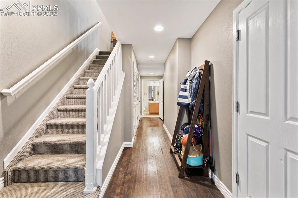 997 Burning Bush Point Monument, CO 80132 - Photo 3 of 34 a view of a hallway with wooden floor and stairs