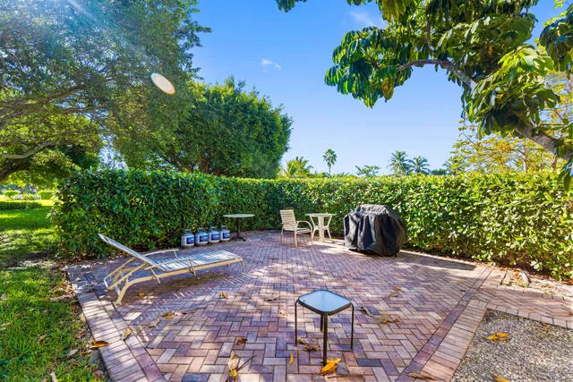 a view of a backyard with sitting area
