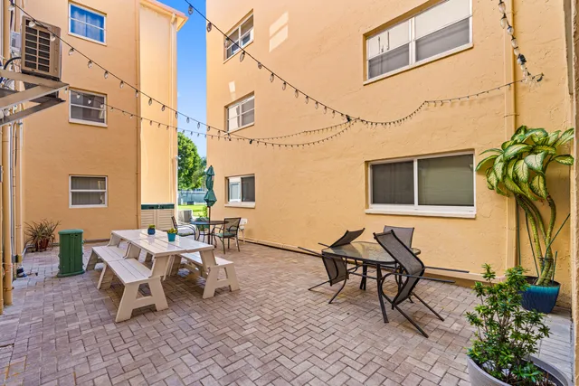 a couple of chairs sitting in backyard of a house