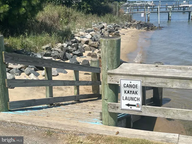 a view of a swimming pool with an outdoor space and seating area