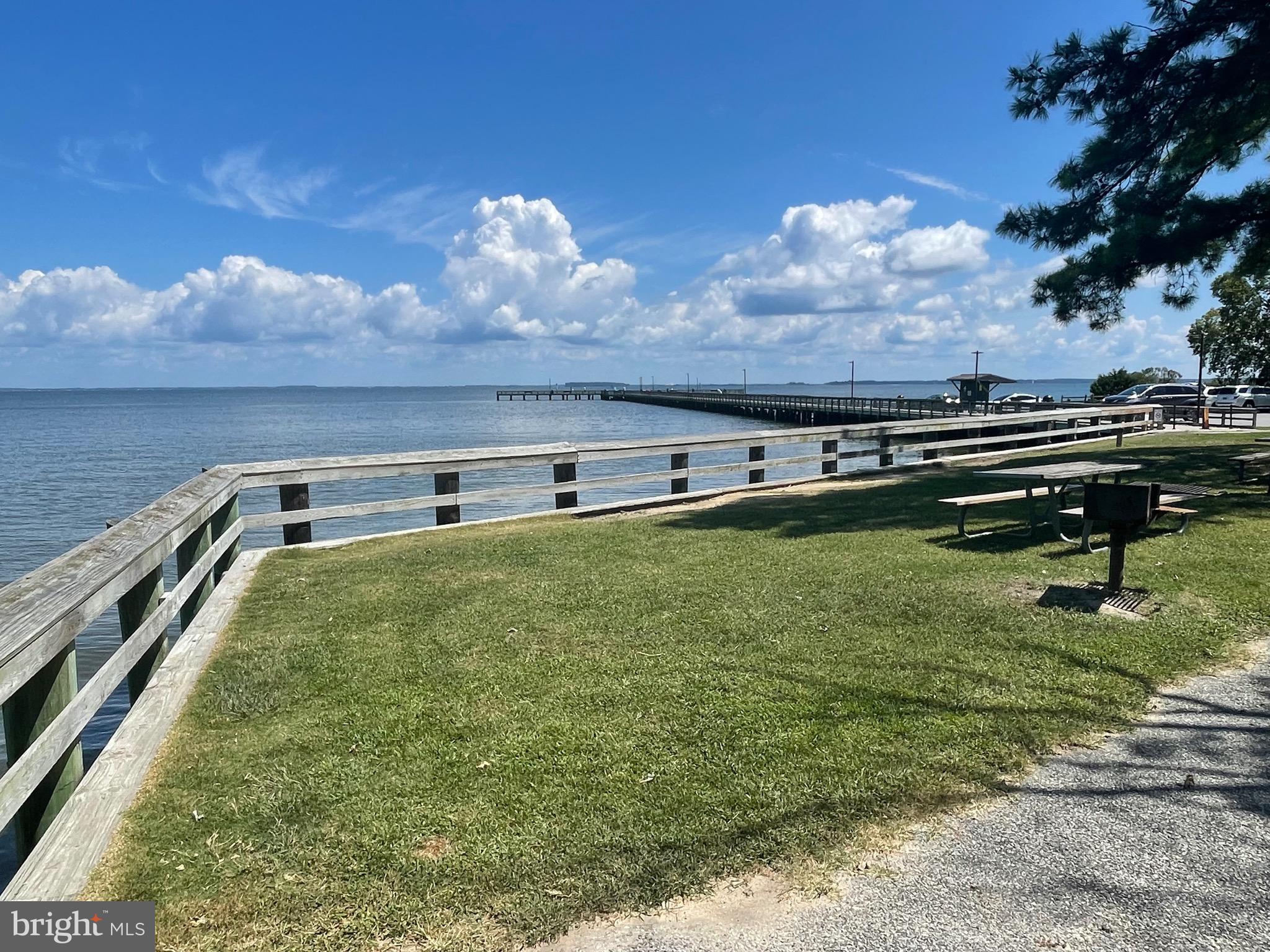 224 Wicomico Road Stevensville, MD 21666 - Photo 18 of 24 a view of a swimming pool with an outdoor space and seating area