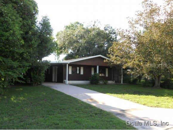 10080 Southwest 98th Terrace Ocala, FL 34481 - Photo 1 of 1 a view of a yard in front of house