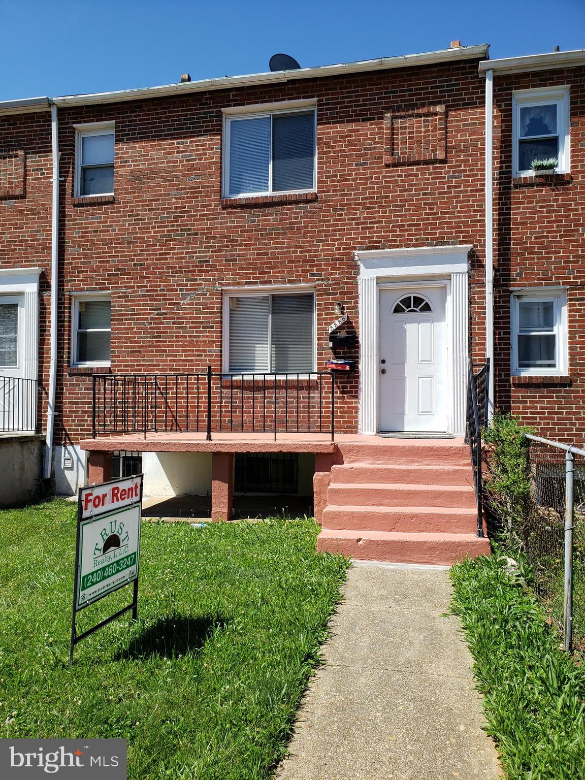 5338 Nelson Avenue, Unit 1 Baltimore, MD 21215 - Photo 1 of 11 a front view of a house with garden