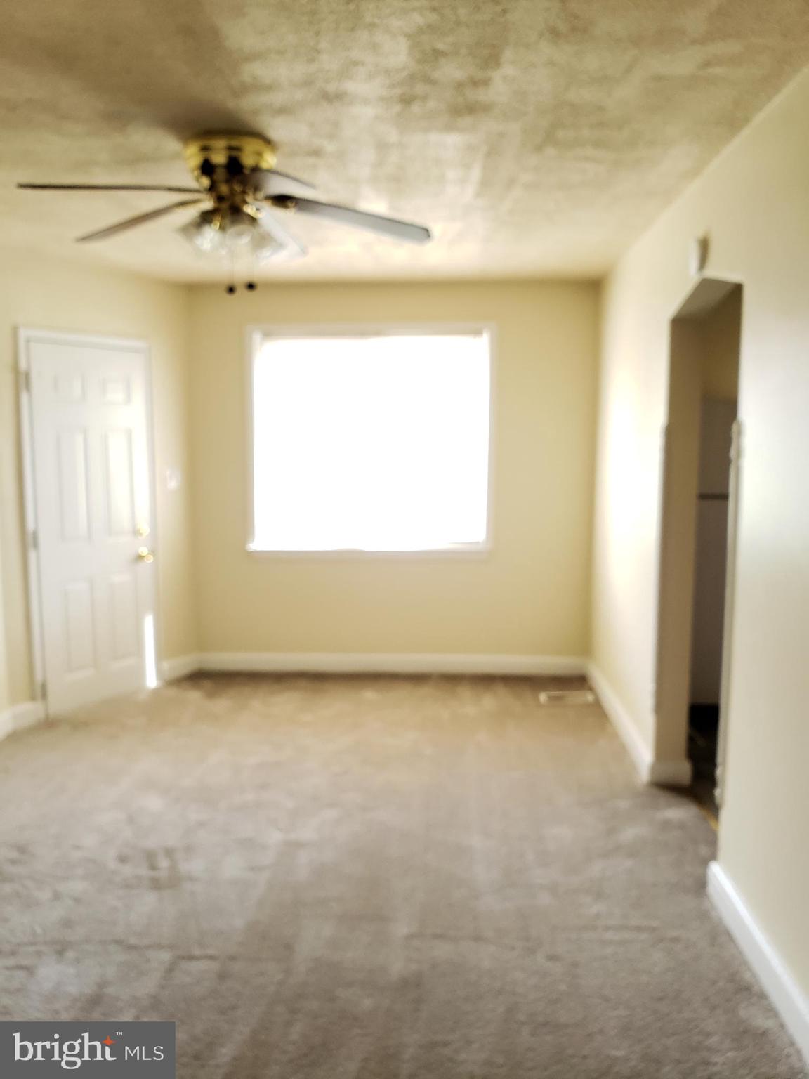 5338 Nelson Avenue, Unit 1 Baltimore, MD 21215 - Photo 3 of 11 a view of a room that has a window in it