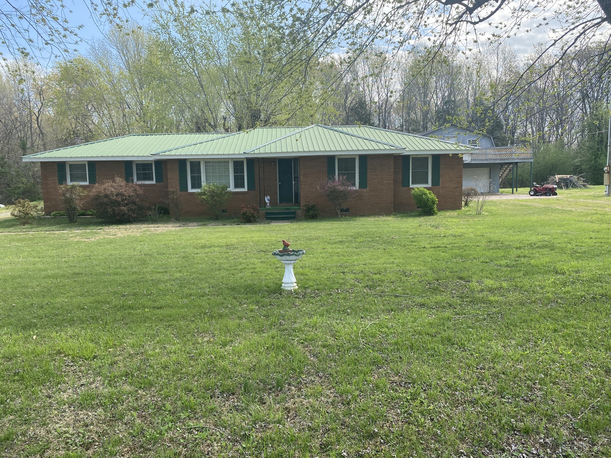 136 New Deal Potts Road Cottontown, TN 37048 - Photo 2 of 24 a front view of a house with a yard
