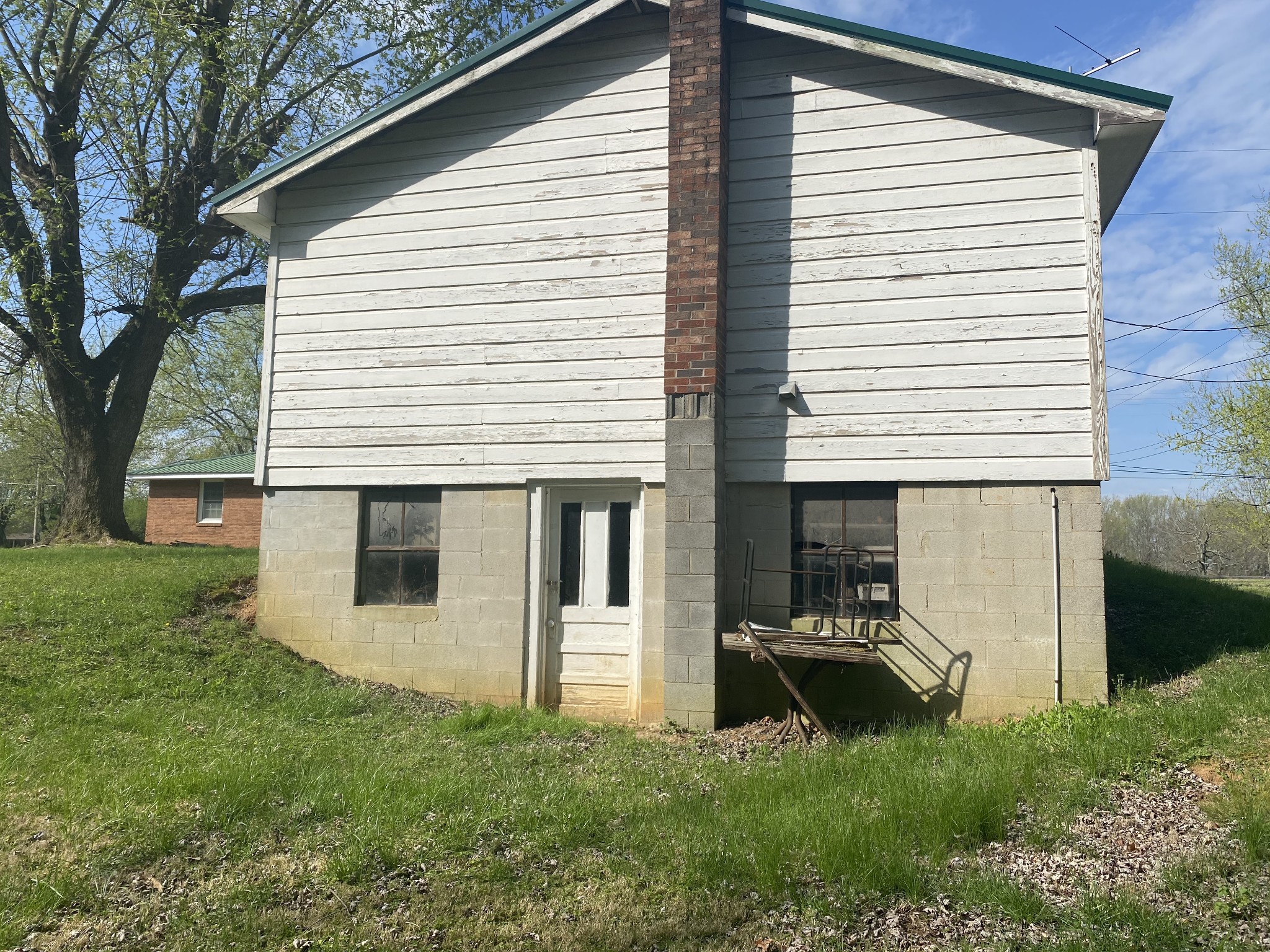 136 New Deal Potts Road Cottontown, TN 37048 - Photo 16 of 24 a view of a house with a backyard
