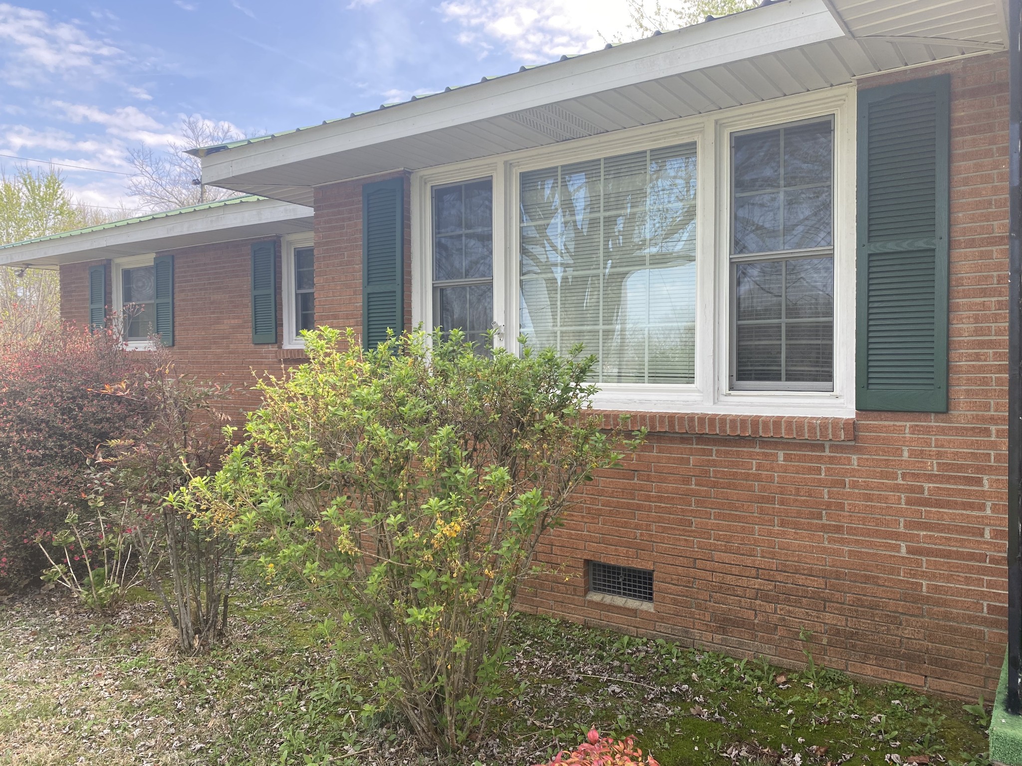 136 New Deal Potts Road Cottontown, TN 37048 - Photo 23 of 24 front view of a brick house with a large window