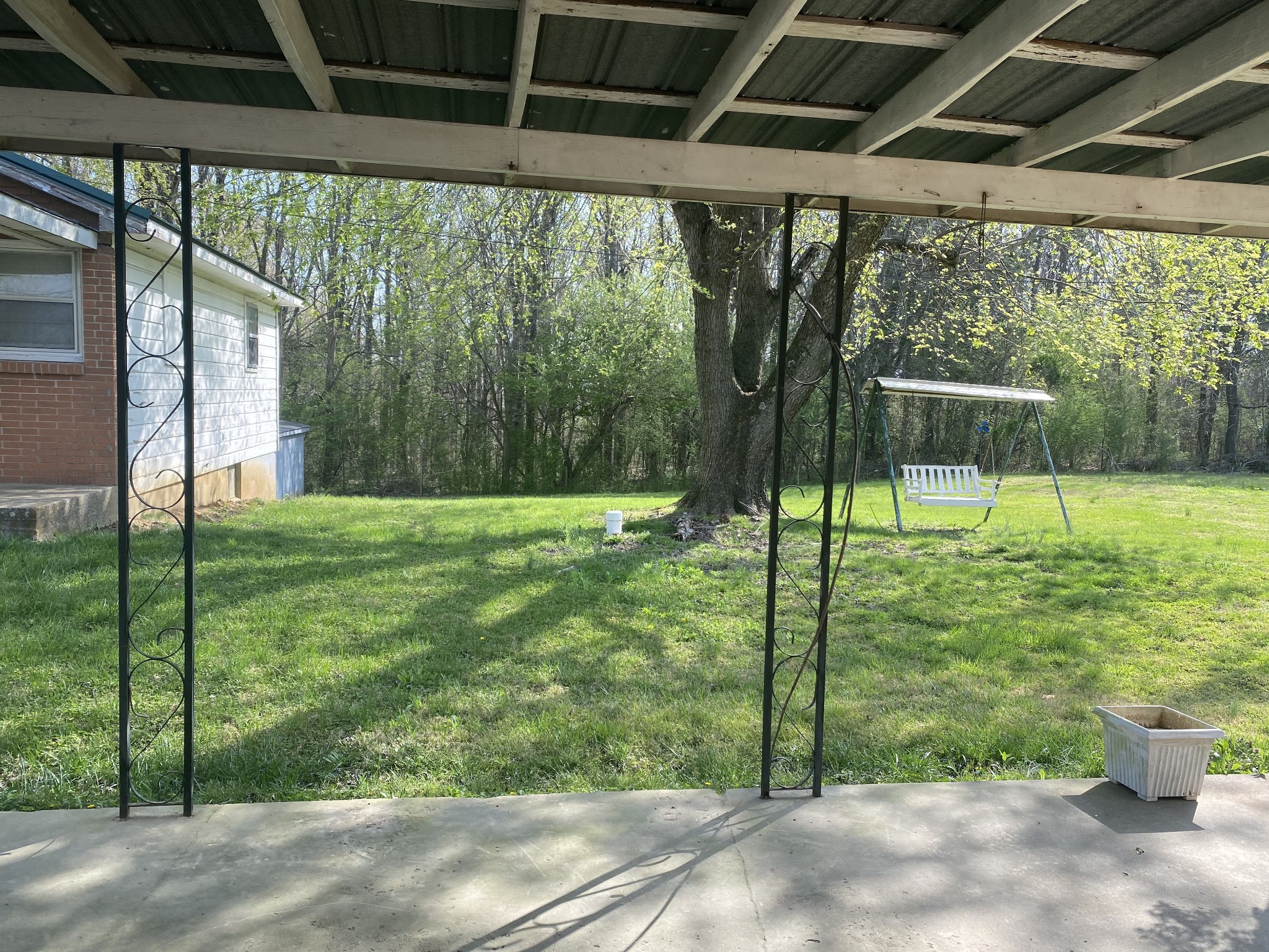 136 New Deal Potts Road Cottontown, TN 37048 - Photo 5 of 24 a view of a porch with a backyard