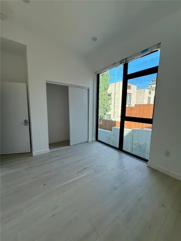 a view of a large kitchen with a large window