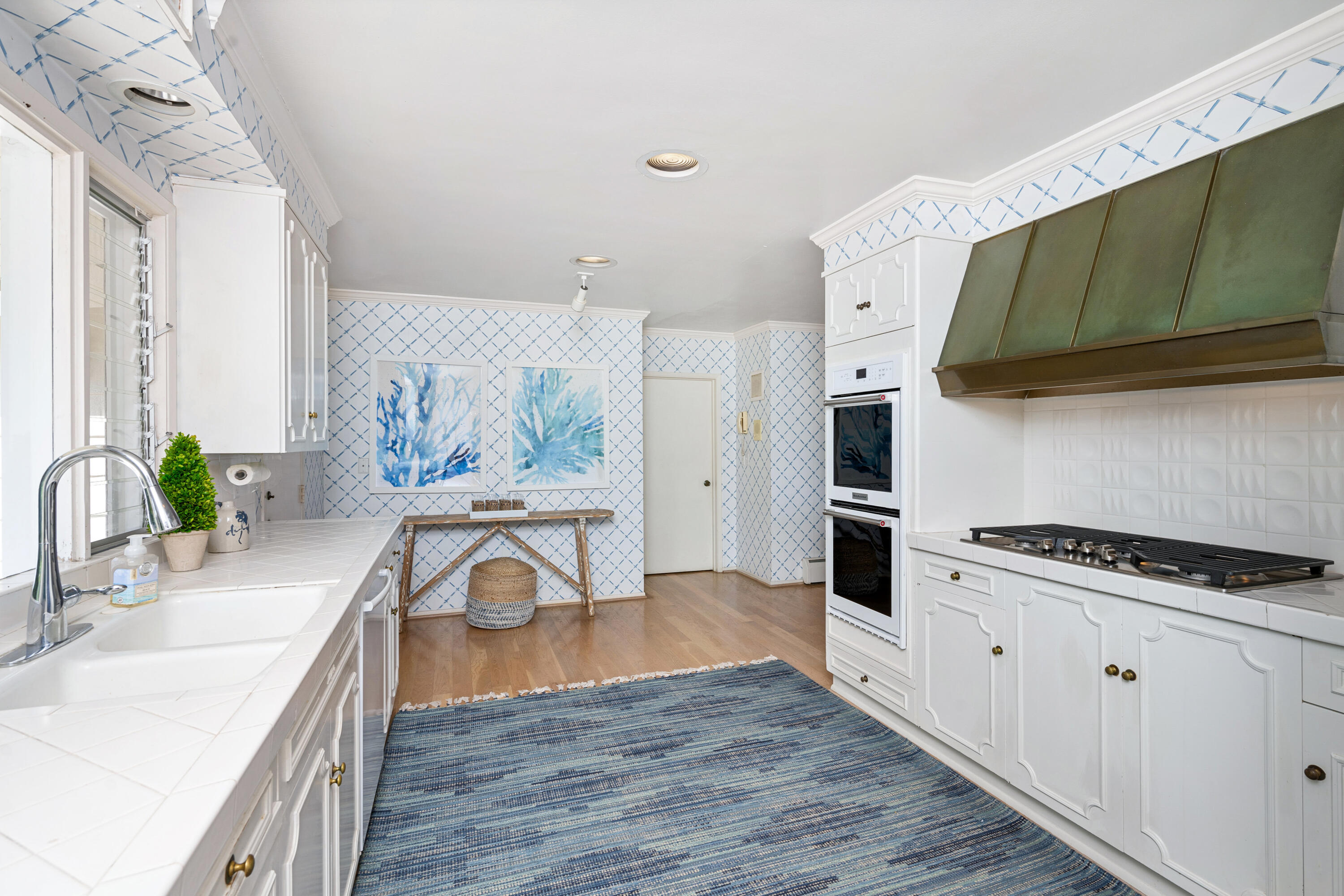 839-841 Summit Road Santa Barbara, CA 93108 - Photo 5 of 20 a kitchen with stainless steel appliances granite countertop a white cabinets a stove a sink and a wooden floors