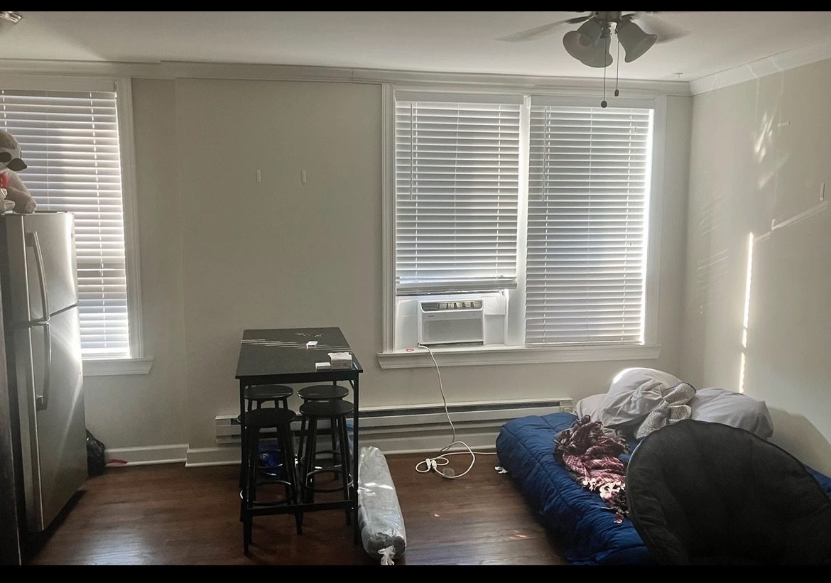 3345 North Marshfield Avenue, Unit 201 Chicago, IL 60657 - Photo 3 of 5 a living room with furniture and a window