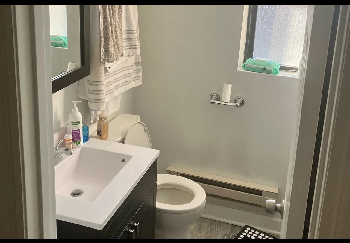 3345 North Marshfield Avenue, Unit 201 Chicago, IL 60657 - Photo 5 of 5 a bathroom with a sink and a toilet