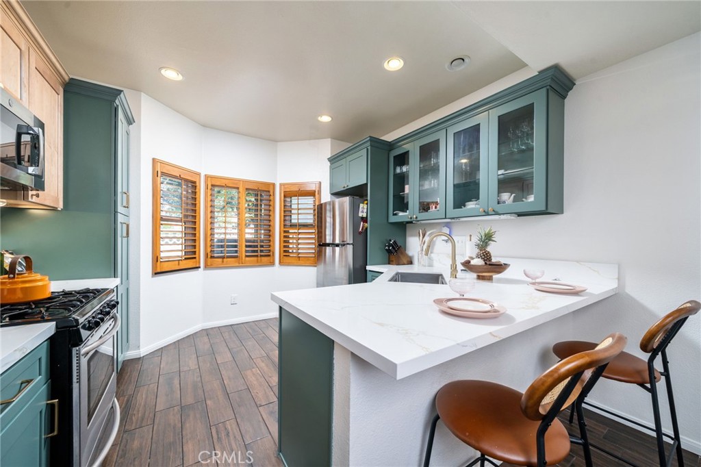 3707 Calle Curacso Riverside, CA 92503 - Photo 2 of 43 a view of a dining room with furniture and wooden floor