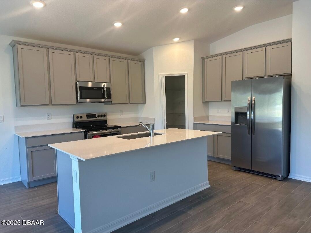 3983 Willow Brk Drive Edgewater, FL 32141 - Photo 3 of 4 a kitchen with stainless steel appliances a refrigerator a stove a microwave a sink and a refrigerator