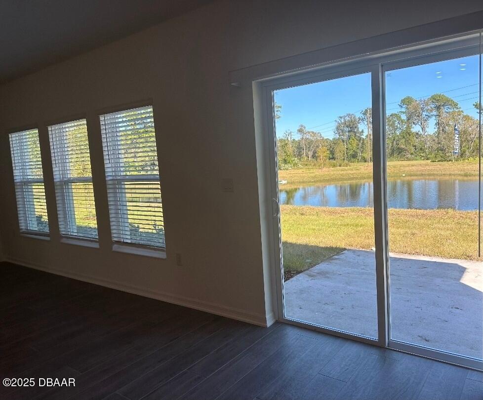3983 Willow Brk Drive Edgewater, FL 32141 - Photo 4 of 4 an empty room with wooden floor and windows