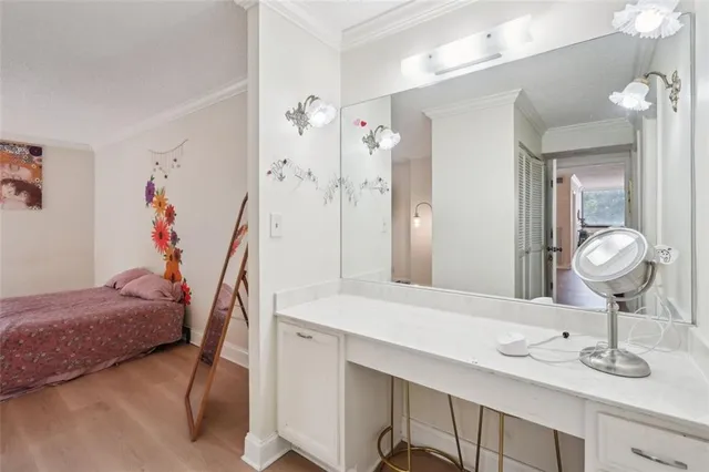 a en suite bathroom with a sink double vanity and shower