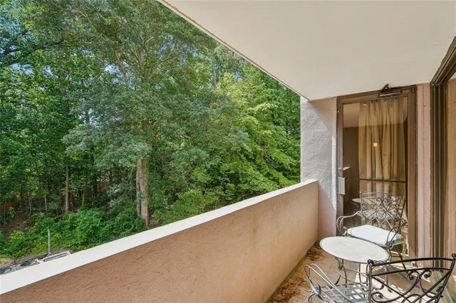 a view of a balcony and chair