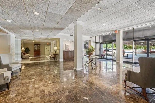 a dining room with furniture a chandelier and fireplace