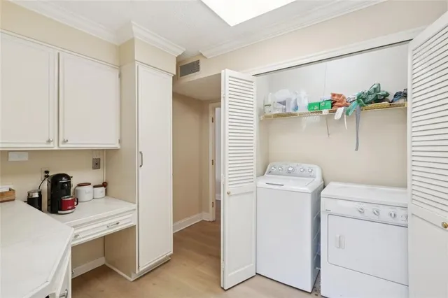 a view of storage and utility room with washer and dryer