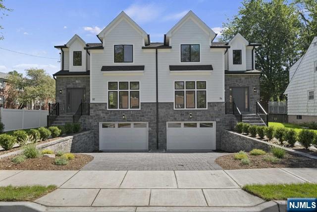 a front view of a house with a garage