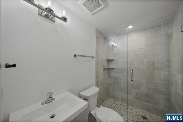 92 Franklin Street Tenafly, NJ 07670 - Photo 19 of 42 a bathroom with a sink and mirror