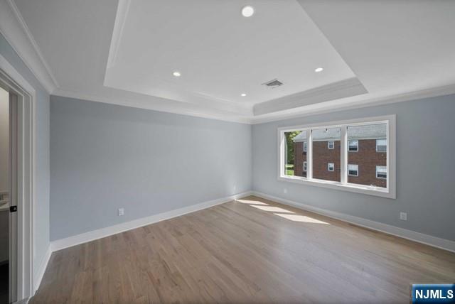 92 Franklin Street Tenafly, NJ 07670 - Photo 23 of 42 an empty room with wooden floor and windows