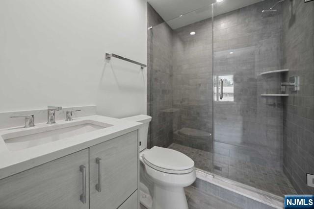 92 Franklin Street Tenafly, NJ 07670 - Photo 24 of 42 a bathroom with a sink a toilet and shower