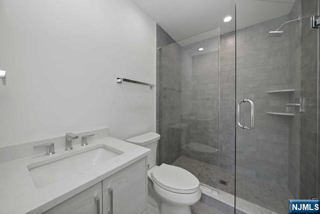 92 Franklin Street Tenafly, NJ 07670 - Photo 25 of 42 a bathroom with a sink toilet and shower