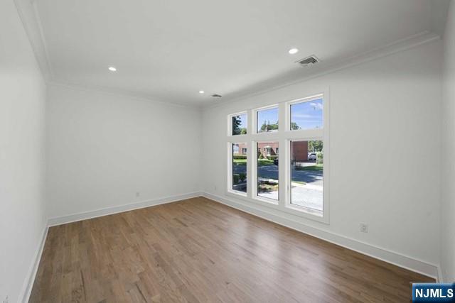 92 Franklin Street Tenafly, NJ 07670 - Photo 35 of 42 an empty room with wooden floor and windows