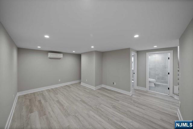 92 Franklin Street Tenafly, NJ 07670 - Photo 37 of 42 an empty room with wooden floor and mirror