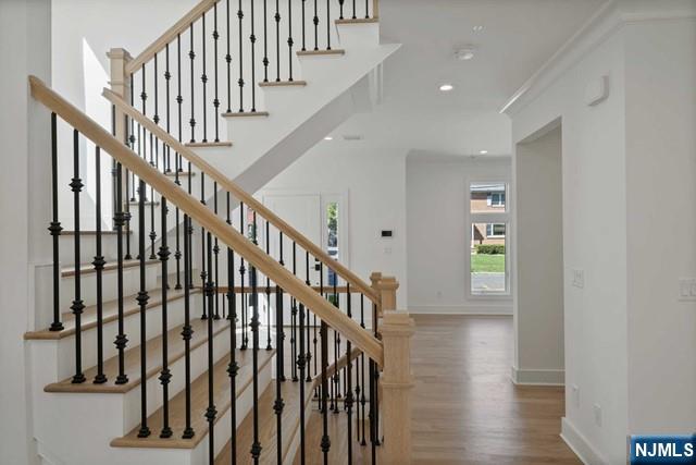 92 Franklin Street Tenafly, NJ 07670 - Photo 5 of 42 a view of staircase with wooden floor and a window