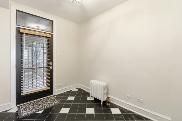 a room with a black white checkered floor with a black white checkered floor