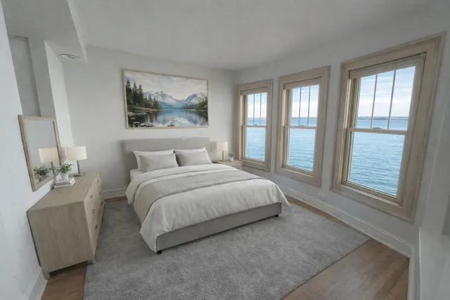 a spacious bedroom with a bed and a couch