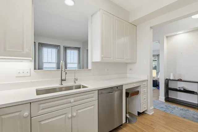 a kitchen with a sink and cabinets